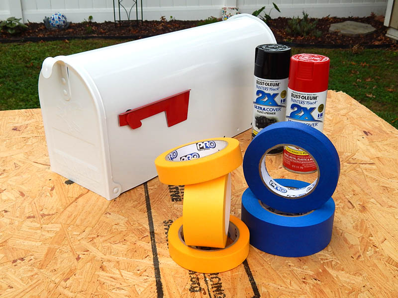 Spray paint and tape, ready to decorate the Barn mailbox