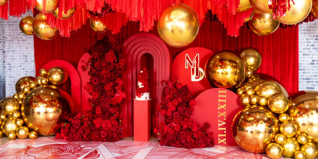 Red and Gold Birthday balloon display.