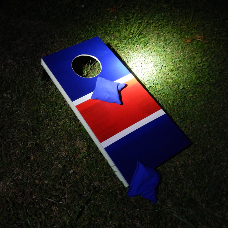 The cornhole game board in the dark... see what happens when we turn the light off!