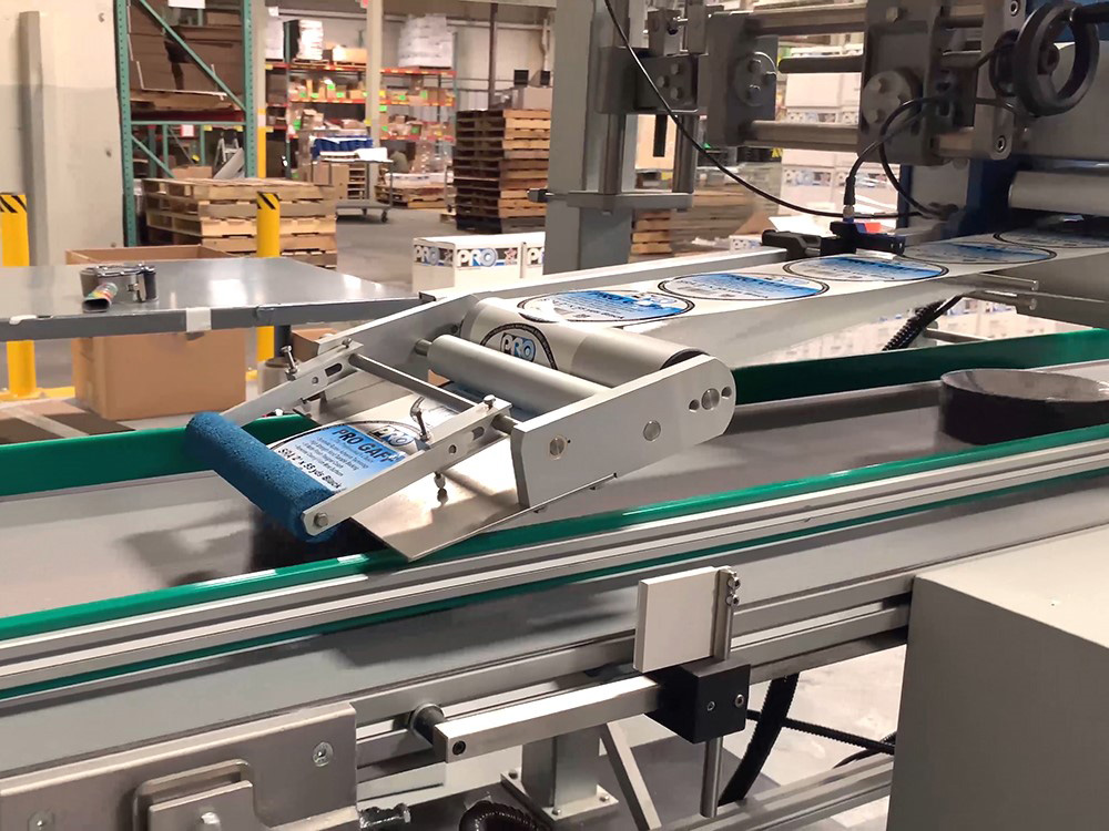 Inline shrink wrapping and automated labeling system from single rolls to multi roll 2, 4 or 6 roll configurations on our new G&A FA300 wide web slitter.