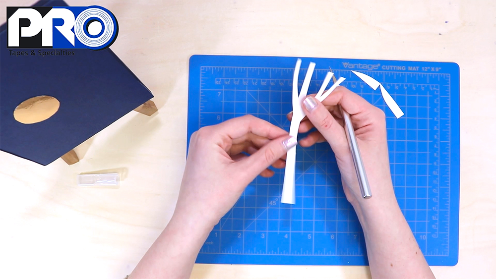 Cut out your first tree from the white cardstock