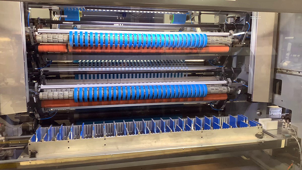 FA300 Wide Web Slitter holds wider jumbo rolls and has faster cycle times which mean increased output combined with packaging automation and a programmable recipes all allow us to service our customers at a very high level